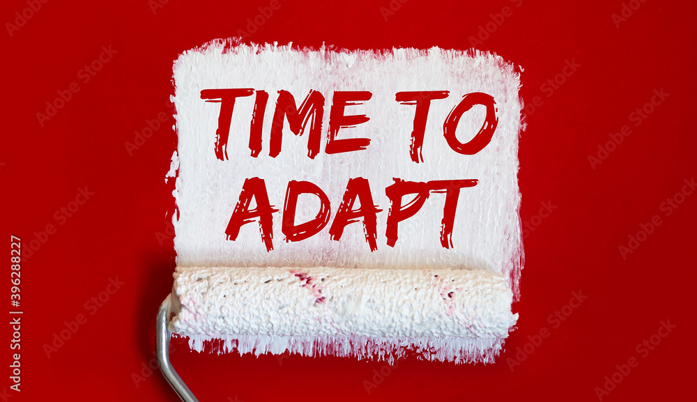 Poster time to adapt . one open can of paint with white brush on red background. top view.