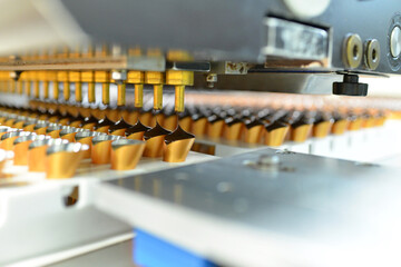 Production of pralines in a factory for the food industry - automatic conveyor belt with chocolate