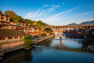 Scenery of old houses in Fenghuang City, Hunan Province, China. The ancient city of Fenghuang is...