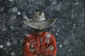 man in sombrero hat with brim, mexican style, latin america, snow cold winter christmas background