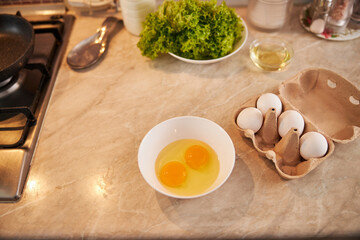 White and yolk of eggs in a dish