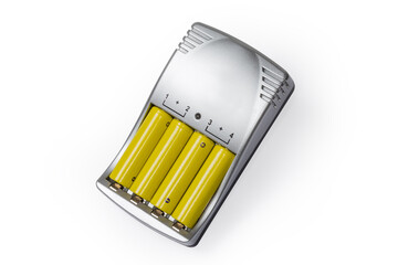Rechargeable AA batteries in smart battery charger on white background
