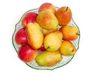 Pears and red apples in glass fruit bowl, top view