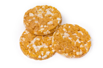 Round puffed multi-grain crispbreads with pumpkin on white background