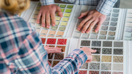 A team of designers are working on a color solution, using a catalogue of samples