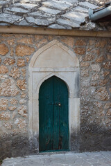 Historic wooden door in a Koski Mehmed Pasha Mosque in Mostar. Bosnia and Herzegovina
