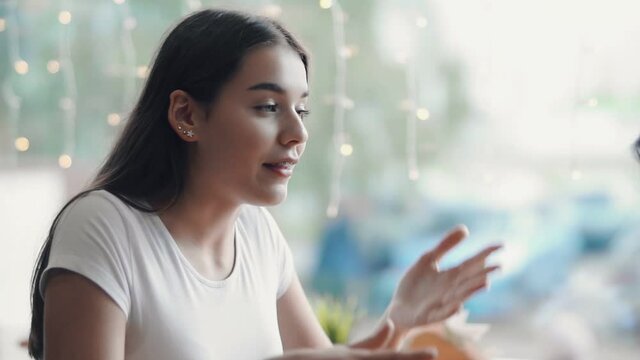 A woman emotionally tells&nbsp;something&nbsp;to her interlocutor