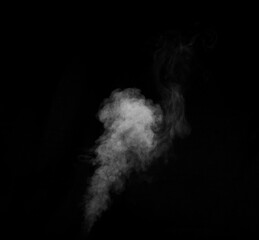 White smoke on black background. Figured smoke on a dark background. Abstract background, design element