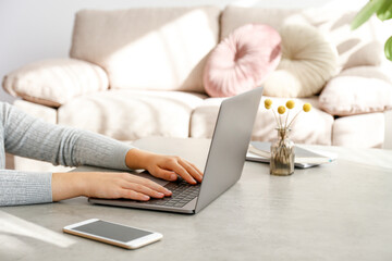 Work from home concept. Cropped shot of woman's hands typing on laptop. Female freelancer working...