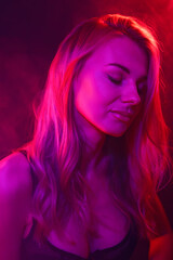 young woman under colored light