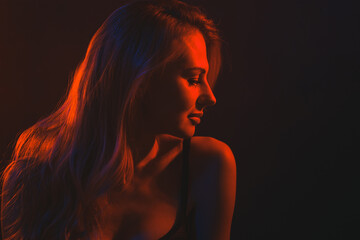 young woman under colored light