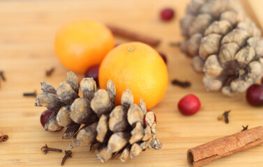 Christmas Gift on Old Wood Background. Spices, tangerines and cones. Kitchen in Christmas time. Gift cards. Calendar page. December. 