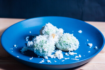 close up to steamed rice cake filled with palm sugar