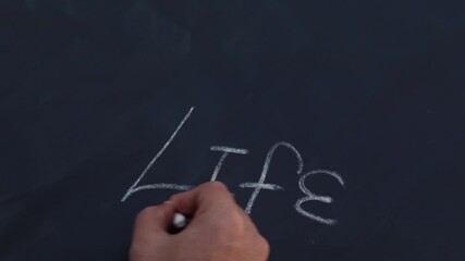school man holding chalk writing on blackboard. life - Powered by Adobe