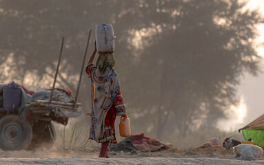 water carrier afghan woman 