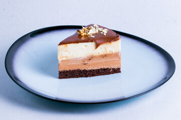 French duo cake in a ceramic plate isolated on a white background close up.