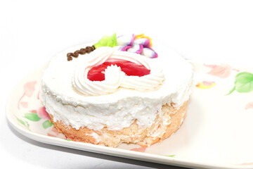 chiffon cake with jelly topped with whipped cream on a white background, fresh and fresh in a bakery that is ready to serve every festival around the world