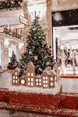 Ginger cookie Christmas fir tree decorated with sweet presents for New Year celebration with light of gerlands c