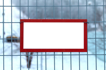 Warning sign on mesh fence, copy space