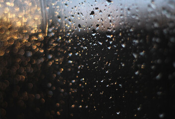 raindrops on the window in the evening sun, like Christmas lights
