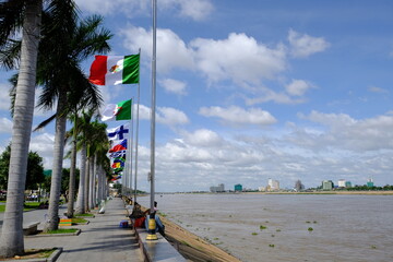 Cambodia Phnom Penh - Riverside Park walkway with international national flags © Marko