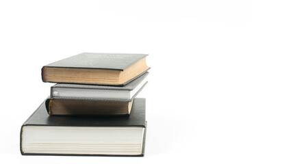 A stack of books on the table. On a white background.