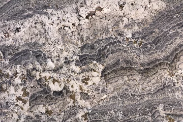 Keuken spatwand met foto Alaska - natuurlijke gepolijste granieten stenen plaat, textuur voor perfect interieur, achtergrond of ander ontwerpproject. © Dmytro Synelnychenko