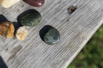 wet stones on a wooden board