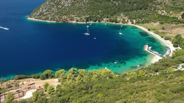 Aerial drone video of bay and beach of Polis in Northern part of Ithaki or Ithaca island a safe sail boat anchorage, Ionian, Greece
