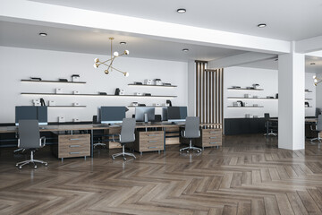 Modern office interior with computers on long wooden table