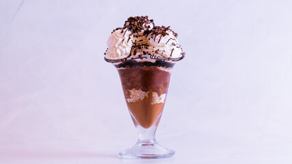 Delicious chocolate dessert in a glass isolated on a white background close up.