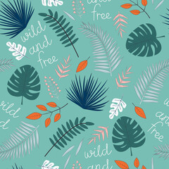Vector seamless pattern with tropical leaves and inscription Wild and Free on green background. For wallpapers, decoration, invitation, fabric, textile and print, gift and wrapping paper.