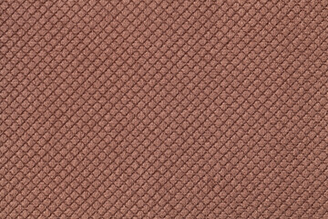 Texture of dark brown fluffy fabric background with rhomboid pattern, macro.