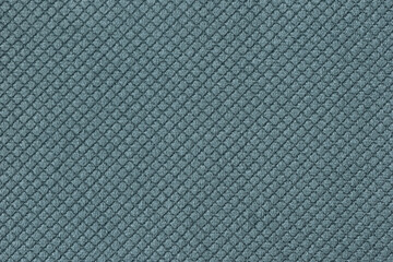 Texture of light blue fluffy fabric background with rhomboid pattern, macro.