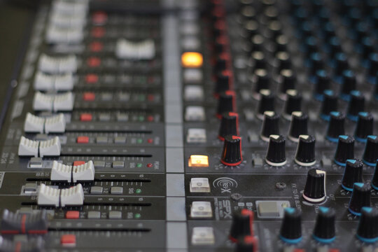 Closeup shot of knobs and buttons on a machine