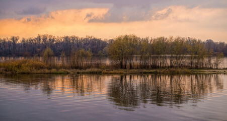 Fototapeta na wymiar Island on the river in winter. Cold sunrise