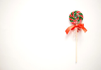 bright sweet christmas lollipop on white background