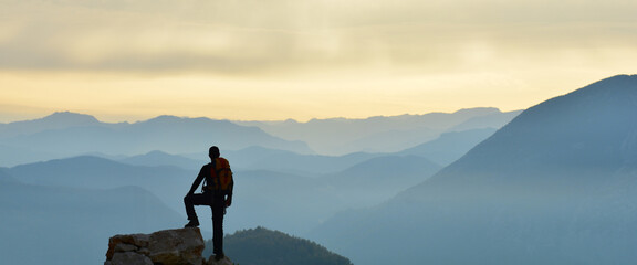 Young Man Watching the View at the Peak