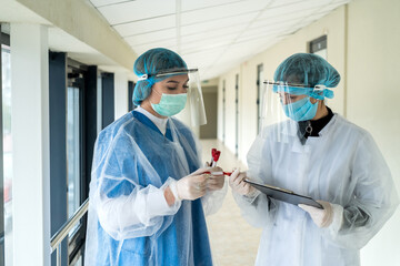Fototapeta na wymiar interns record the results of a laboratory test for coronavirus in a modern clinic
