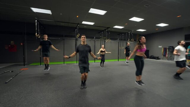 Group of people skipping rope at gym