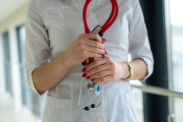 Close-up of female nurse hand holding a stethoscope