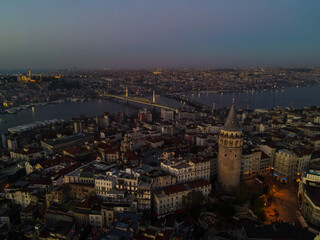 Aerial Galata Tower at Sunset. 
Galata Bridge and Golden Horn of Istanbul with beautiful colors at Sunset. 