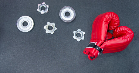 Gym background and fitness equipment and valentine concept. Boxing glove in shape of heart.