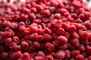 Raspberry berries background. Garden raspberry. Blurred. 