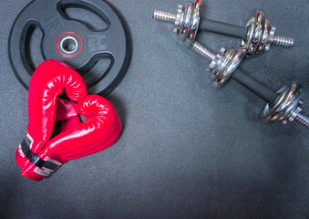 Gym background and fitness equipment and valentine concept. Boxing glove in shape of heart.