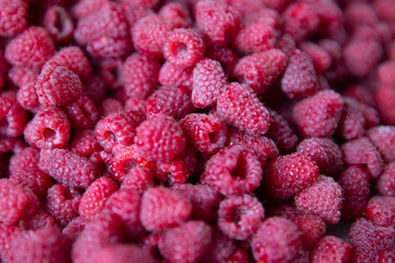 Raspberry berries background. Garden raspberry. Blurred. 