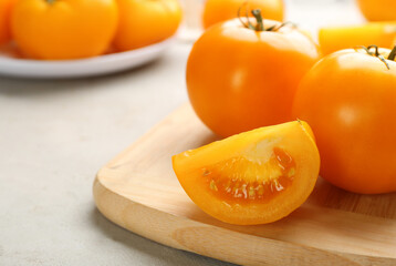 Ripe yellow tomatoes on grey table, closeup. Space for text