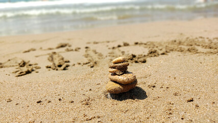 concept of balance sea rocks on sand symbolizing zen