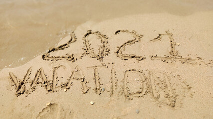 handmade written  VACATION on the sea beach
