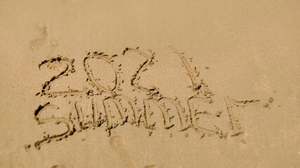 handmade written  Summer 2021 on the sea beach